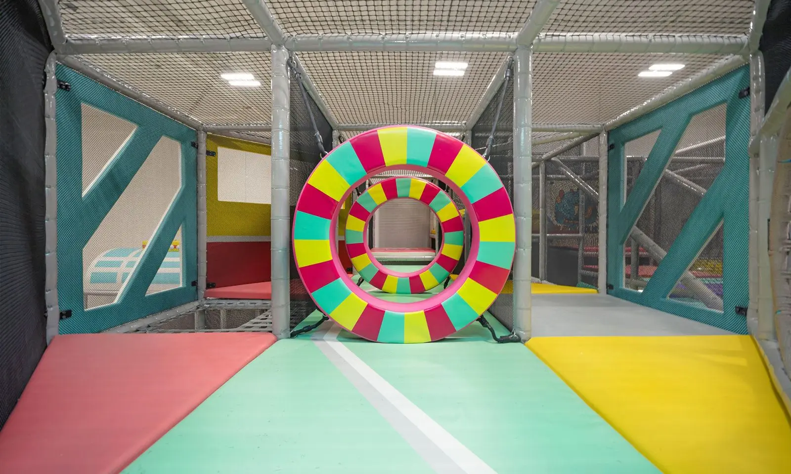 Children climbing and sliding at Playtropolis indoor play area near Vaughan and Woodbridge