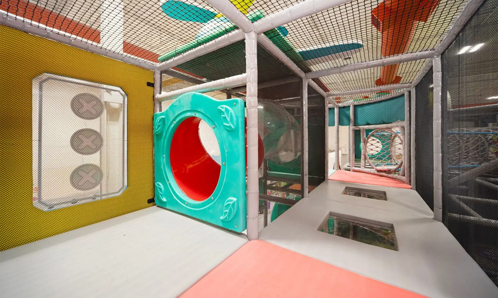 Kids enjoying trampoline and play structures at Playtropolis indoor playground near Vaughan and Woodbridge