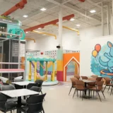 Kids playing in colorful indoor playground play area at playtropolis in woodbridge near vaughan
